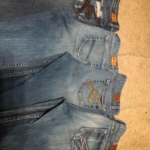 (4) Womens BKE Dark Blue Denim Jeans size 33x 35 1/2 long.